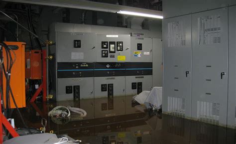 green electrical power box submerged in water|water damaged electrical equipment.